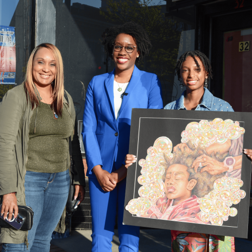 Rep. Underwood stands next to the winner of the 2023 Art Competition.